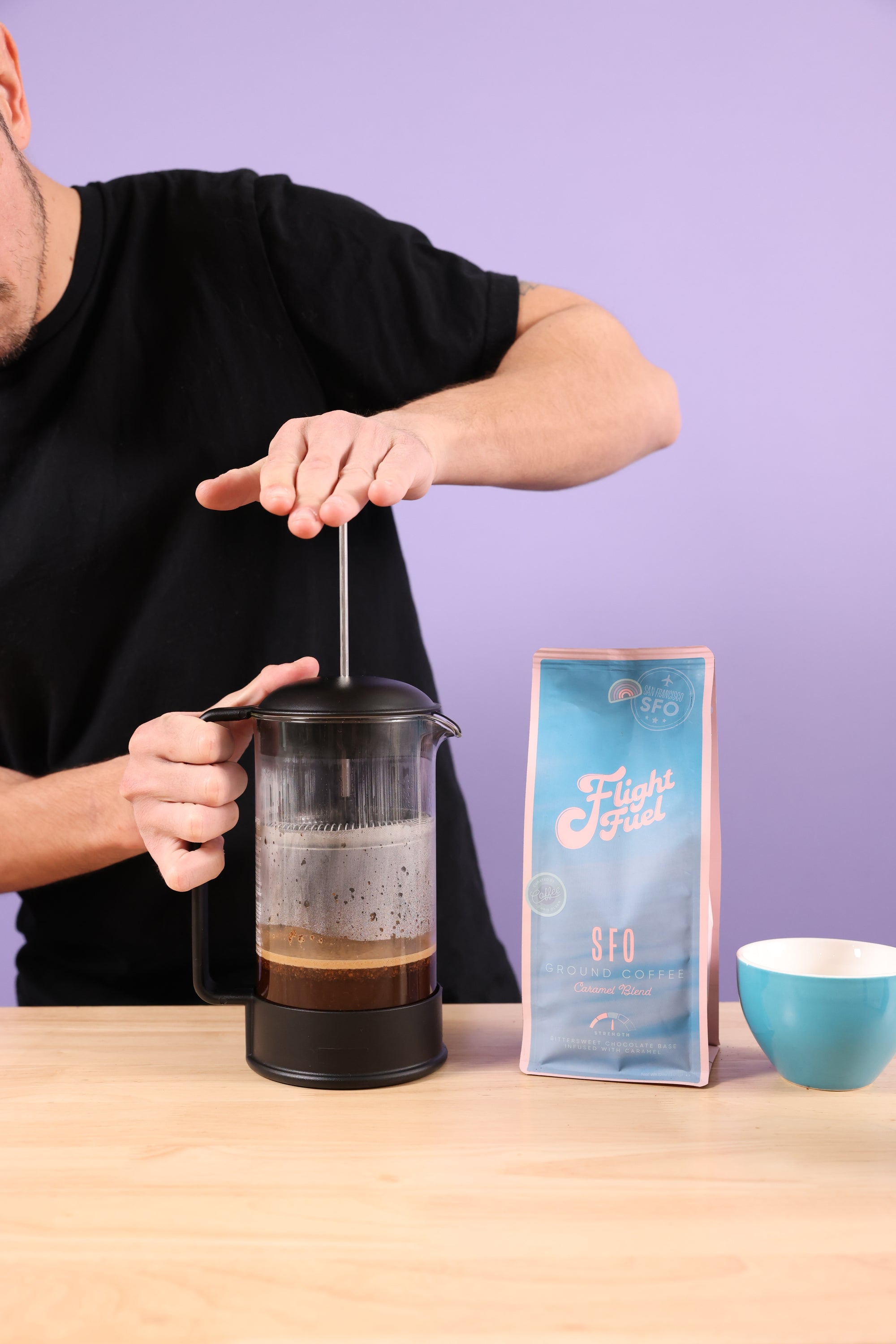 Barista making Flight Fuel Coffee in a french press