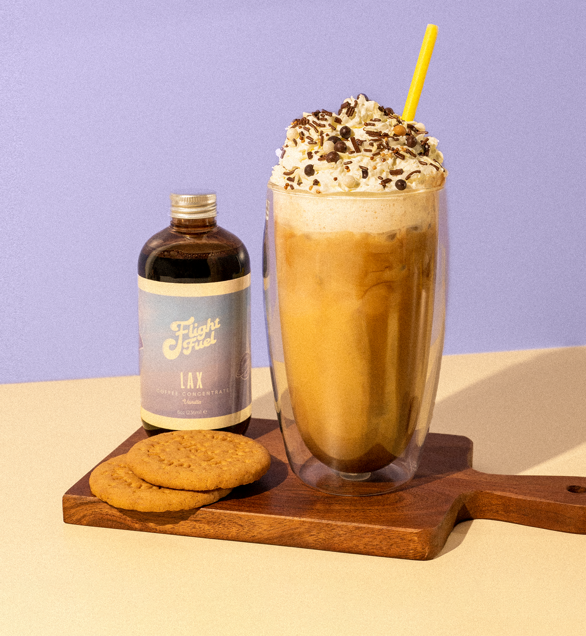Vanilla Flavor Coffee Concentrate 8oz Bottle with a Vanilla iced coffee and some biscuits.